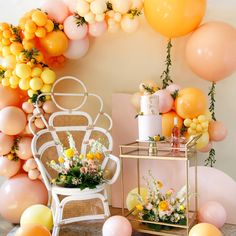 a room with balloons and flowers on the wall