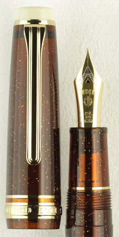 the fountain pen is brown and gold