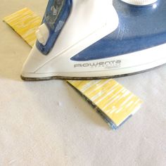 a blue and white iron sitting on top of a table