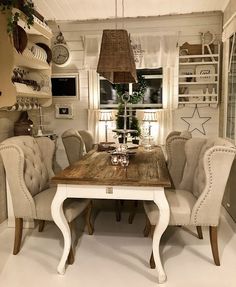 a dining room table with chairs around it