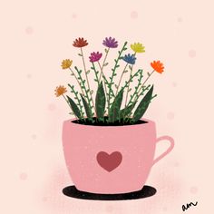 a pink coffee cup with flowers in it