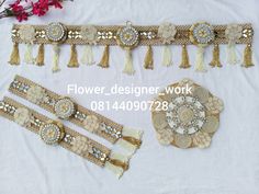 several different types of beaded and sequins with flowers on the table next to them