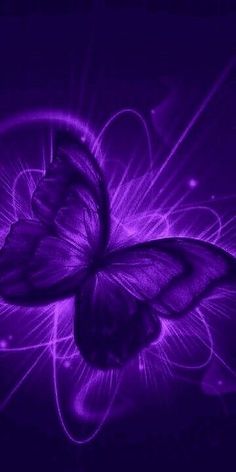 a purple butterfly flying through the air