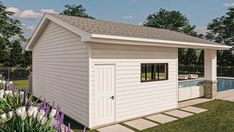 a small white shed with a pool in the back ground and purple flowers around it