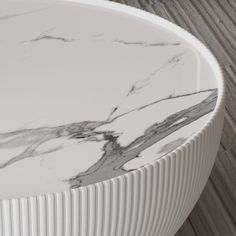 a close up of a white and black marble table