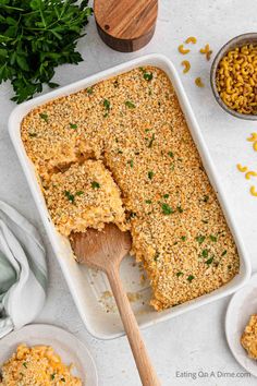 a casserole dish filled with rice and topped with parsley