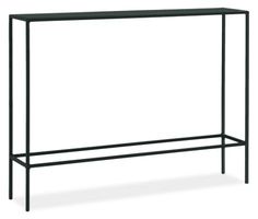 a black metal shelf with two shelves on top and one shelf below it, against a white background