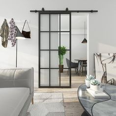 a living room filled with furniture and a sliding glass door