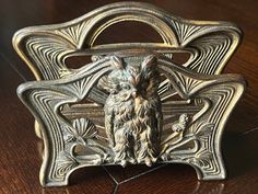 an ornate metal object on a wooden table