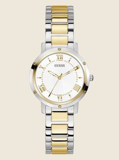 Optimize your day with this two-tone analog watch featuring screw hardware around the bezel, silver and gold-tone detailing throughout on a stainless steel bracelet. Case diameter in mm: 34 2 year limited warranty White Metal Watches With Metal Dial, White Metal Watch With Metal Dial, Circle Watch, Womens Circle, Silver Watches Women, Guess Watch, Watch For Women, Analog Watch, Two Tone Watch