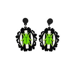 Inspired by Beetlejuice these earrings feature the iconic stripes and beetle encased within an ornate frame. They are made from 3 layers of acrylic measuring 4.5 cm and fastened to complimentary circle studs and allergy free ear post. Beetle Earrings, 3d Printed Earrings, Green Beetle, Dragon Earrings, Cameo Earrings, Laser Cut Earrings, Gothic Earrings, Cute Black And White, Detailed Jewelry