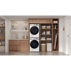 a washer and dryer in a room with open shelves on the wall next to each other