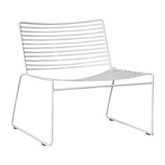 a white plastic chair with slats on it