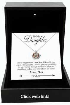 a necklace in a box with the words to my daughter on it