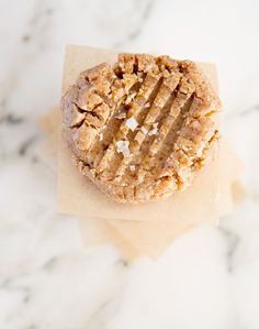 a cookie sitting on top of a piece of paper