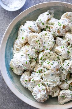 a bowl filled with potato salad on top of a table