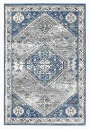 a blue and gray rug with an ornate design on the bottom, in front of a white background