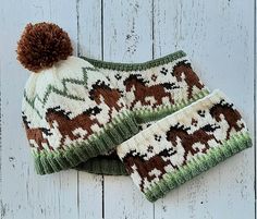 two knitted hats with brown and green horses on them