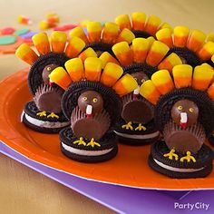 there are cookies and candy in the shape of turkeys on top of each other