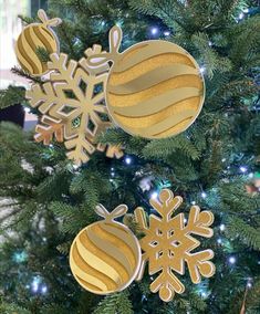 christmas ornaments hanging from the top of a tree