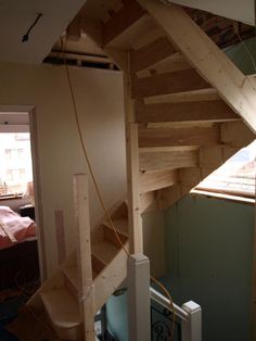 a room with a bed and a window next to a heater on the wall