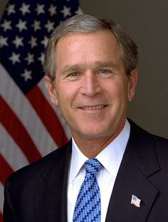 a man wearing goggles with an american flag in the background