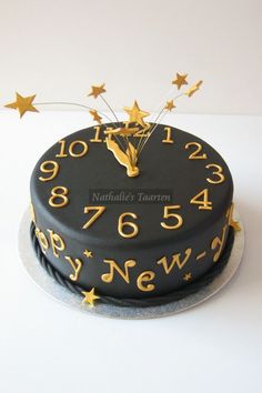 a black cake with gold stars on it