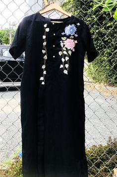 ❤ The black linen hand embroidered dress is very soft, skin friendly, breezy and comfortable. ❤ Item description: - A lovely, unique and elegant dress with colourful embroidered climber tree and hydrangea motifs. - Material: linen, coconut button, embroidery threads. - Environmentally friendly. - This dress is very useful, go with any outfit, that can be used to go to school, go out, go shopping. It is a perfect gift for yourself or your beloved. ❤ Care instructions: The best way to wash embroid Linen Tunic Dress With Floral Embroidery, Black Linen Short Sleeve Dress For Spring, Black Short Sleeve Linen Dress For Spring, Black Cotton Embroidered Short Sleeve Dress, Black Cotton Embroidered Dress With Short Sleeves, Embroidered Short Sleeve Linen Dress, Button Embroidery, Hand Embroidered Dress, Black Linen Dress