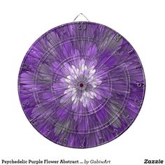 a purple flower is shown in the center of a dart board that has an arrow on it