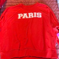 Bright Red Sweatshirt Tha Says Paris On It.(No Hood) Sporty Red Tops For College, Red T-shirt For Spring Loungewear, Red Crew Neck Top For College, Red Sporty Tops For College, Trendy Red T-shirt For College, Trendy Red Crew Neck Sweatshirt, University Red Tops For Fall, Casual Red Graphic Print Sweatshirt, Red Letter Print Tops For College