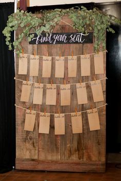 a wooden sign with notes attached to it that says, a basic guide to wedding stationery