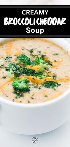 creamy broccoli cheddar soup in a white bowl with a black border