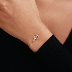 "1- P R O D U C T ∙  D E S C R I P T I O N Showcase your love with our Interlocking Heart Bracelet in 14K Solid Gold. Perfect as a couple bracelet or a stunning gift for her, this double heart bracelet captures the essence of romance. Crafted from 14k solid gold, it adds a touch of luxury to any outfit. This 14k gold jewelry is not just a purchase, but an investment in timeless style. 2- P R O D U C T ∙  D E T A I L S Gold material: 14K solid gold Choice of gold color: Yellow gold, Rose gold, White gold Choice of chain length: 5\", 5.5\", 6\", 6.5\", 7\" +1\" Extender Dimensions: * Height: 9 mm /  0.35 in * Width: 12 mm /  0.47 in 3- S H I P P I N G ∙ A N D ∙ R E T U R N S We know you're excited to get your hands on your order, and we're just as excited to get it in your hands. We take pri Gold Heart Bracelet With Heart Charm For Promise, Gold Promise Bracelet With Heart Charm, 14k Gold Bracelet For Everyday Valentine's Day, 14k Gold Bracelet For Everyday And Valentine's Day, Valentine's Day Heart Charm Bracelet For Promise, Valentine's Day Promise Heart Charm Bracelet, Fine Jewelry Diamond Name Bracelet For Gift, Fine Jewelry Diamond Name Bracelet As Gift, Diamond Name Bracelet For Gift, Fine Jewelry