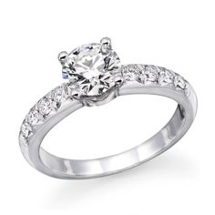 a white gold engagement ring with diamonds on it