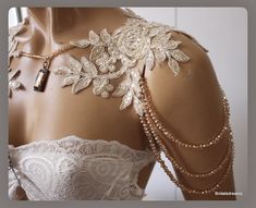 a mannequin is adorned with pearls and beads