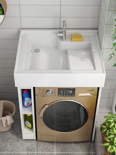 a kitchen sink with the door open next to a washer and dryer combo