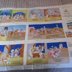 there are many pictures of the birth of jesus on this sheet that is laying on the bed