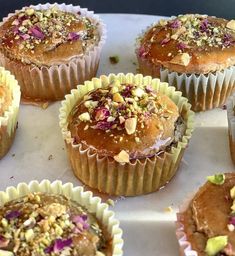 there are many cupcakes on the tray ready to be eaten