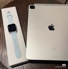 an apple watch sits next to the box