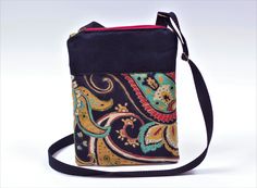 "BEKABOO BAGS ARE MADE WITH LOVE from SPECIAL FASHION, DESIGNER &/or RESCUED FABRICS---VINTAGE, THRIFT, & BEYOND-- MAKING EACH BAG A UNIQUE, ONE OF A KIND PIECE! This over the shoulder cross body bag, is a mini purse that will hold your essentials such as wallet, lipstick, keys and cellphone.  This stylish slim bag is a ZIPPER POCKET bag, with an extra deep OUTER POCKET, made of durable exterior grade canvas in an exotic paisley print, black faux suede with RED Zipper and a green canvas back.  Fully Lined with bright red satin & interfaced for structure & durability.    Dim. approx. 7.5\"wide x 10\" long--adjustable strap. (max 49\").   Ideal for traveling--passport or a day of shopping, festivals, work, or everyday use.   Perfect gift for a birthdays, back to school or Christmas.   Spot c Black Bag With Zipper Pocket As Gift, Black Square Bag With Zipper Pouch, Vintage Thrift, Cross Body Purse, Boho Bag, Mini Purse, Pocket Bag, Red Satin, Small Shoulder Bag