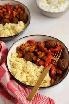 two bowls filled with rice, meatballs and veggies next to a fork