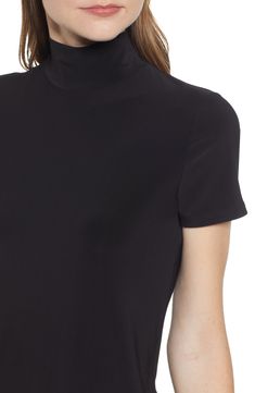 Strike a sleek and slimming silhouette in this mock-neck top with short sleeves for easy wear in any season. Mock neck Short sleeves 94% polyester, 6% elastane Machine wash, line dry Imported Point of View Casual Mock Neck Top In Solid Color, Casual Mock Neck Top, Casual Stretchy Mock Neck Top, Classic Fitted Elastane Tops, Workwear Mock Neck Top In Elastane, Fitted Mock Neck Elastane Top For Work, Classic Fitted Short Sleeve Top For Work, Fitted Mock Neck Top For Work, Fitted Short Sleeve Top For Workwear