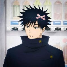 an anime character with black hair wearing a hoodie and standing in front of a machine