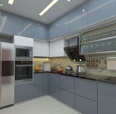 a modern kitchen with stainless steel appliances and blue cabinets