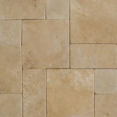 a close up view of a tan tile floor