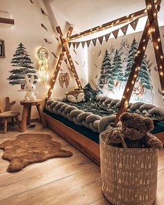 a teddy bear sitting on top of a bed in a room decorated with christmas lights