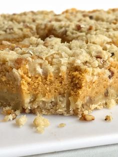 a piece of cake sitting on top of a white plate covered in crumbs