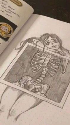 an open book with a drawing of a skeleton in it's corner and some stamps on the pages