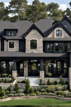 a large house with lots of windows and landscaping