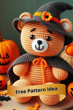 a crocheted teddy bear wearing a witches hat and holding a sign that says free pattern idea